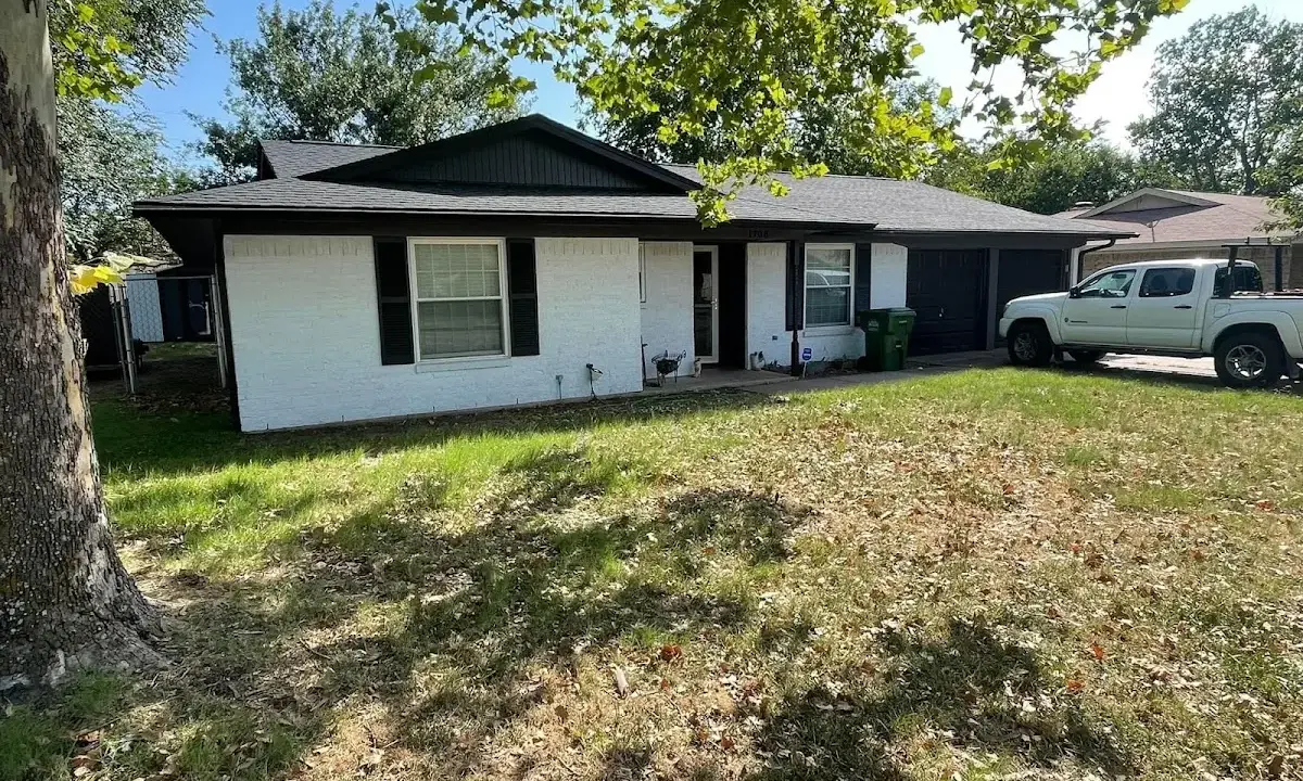Professional roofing crew working on a residential roof in Berryville